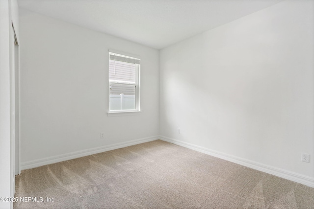 2446 Glade Ln, Green Cove Springs, FL 32043 - spare room with light colored carpet and baseboards