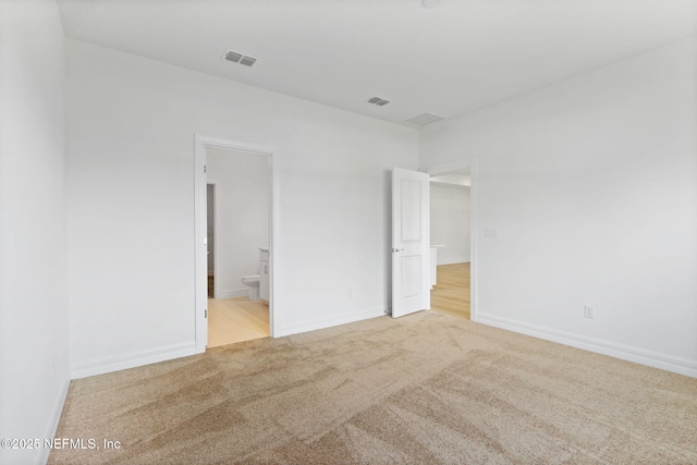 2446 Glade Ln, Green Cove Springs, FL 32043 - unfurnished bedroom with carpet floors, connected bathroom, and baseboards