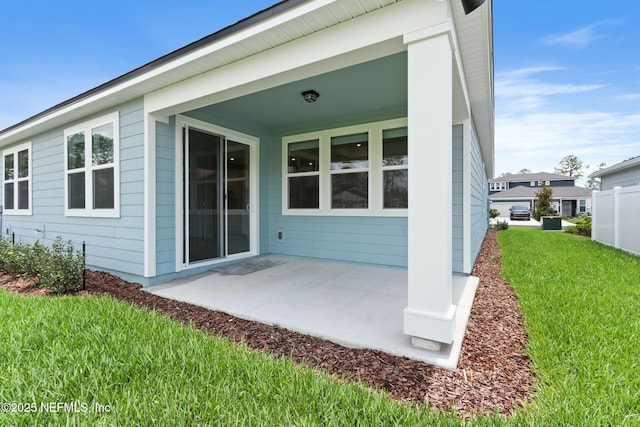 2446 Glade Ln, Green Cove Springs, FL 32043 - rear view of property with a lawn and a patio area