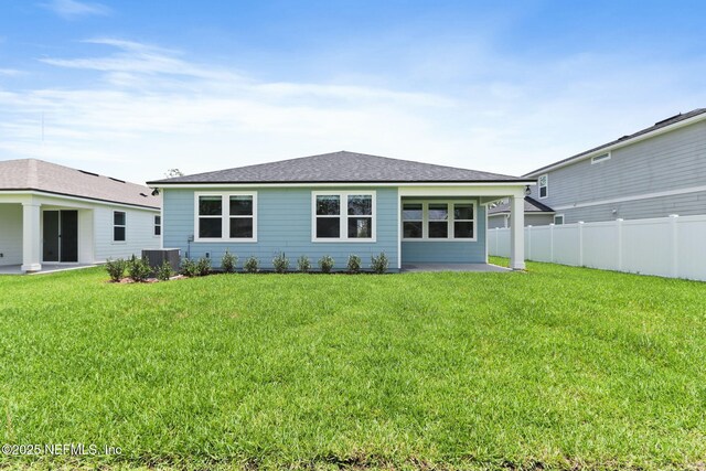 2446 Glade Ln, Green Cove Springs, FL 32043 - back of property with a patio area, central AC, and a shingled roof