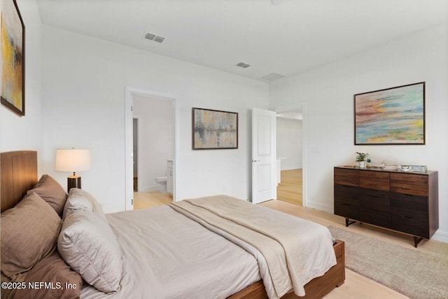 2446 Glade Ln, Green Cove Springs, FL 32043 - bedroom featuring light wood finished floors and connected bathroom