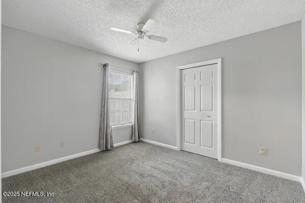4420 Timber Hollow Way, Jacksonville, FL 32224 - unfurnished bedroom with carpet flooring, a textured ceiling, baseboards, and a ceiling fan