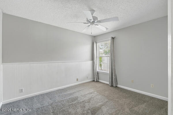 4420 Timber Hollow Way, Jacksonville, FL 32224 - unfurnished room featuring a ceiling fan, carpet floors, and a textured ceiling