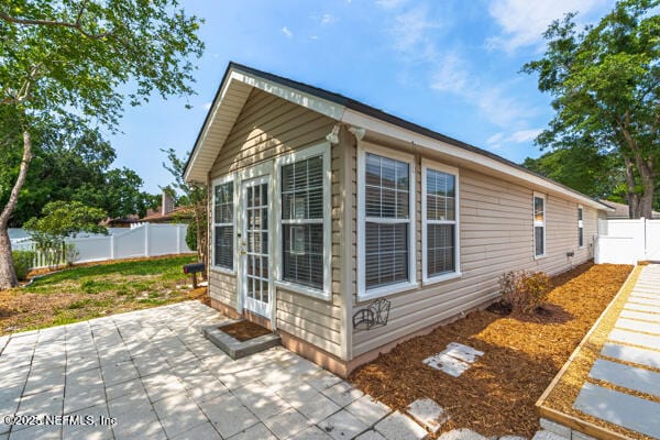 4420 Timber Hollow Way, Jacksonville, FL 32224 - view of home's exterior featuring a patio area and a fenced backyard