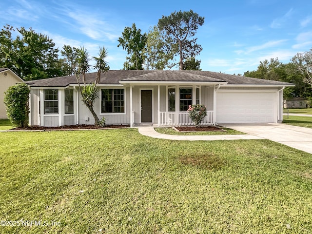 2439 Burns Dr, Middleburg, FL 32068 - ranch-style home featuring an attached garage, driveway, covered porch, and a front yard