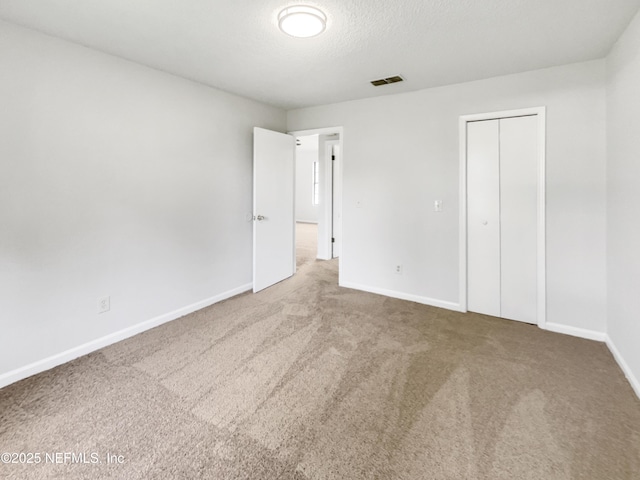 2439 Burns Dr, Middleburg, FL 32068 - unfurnished bedroom featuring carpet, baseboards, and a closet