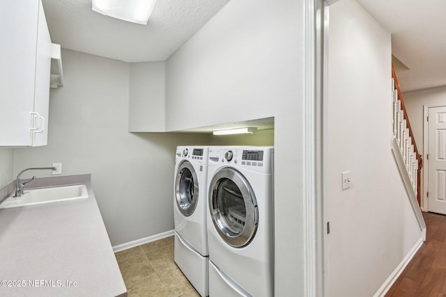 13022 Huntley Manor Dr, Jacksonville, FL 32224 - washroom featuring washer and dryer, a sink, and baseboards