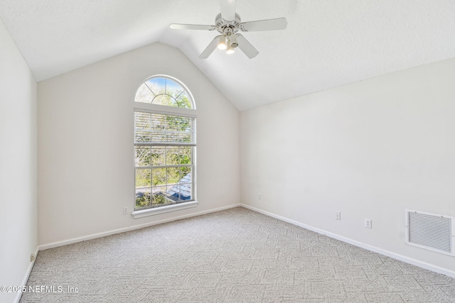 13022 Huntley Manor Dr, Jacksonville, FL 32224 - carpeted spare room featuring vaulted ceiling, a ceiling fan, and baseboards