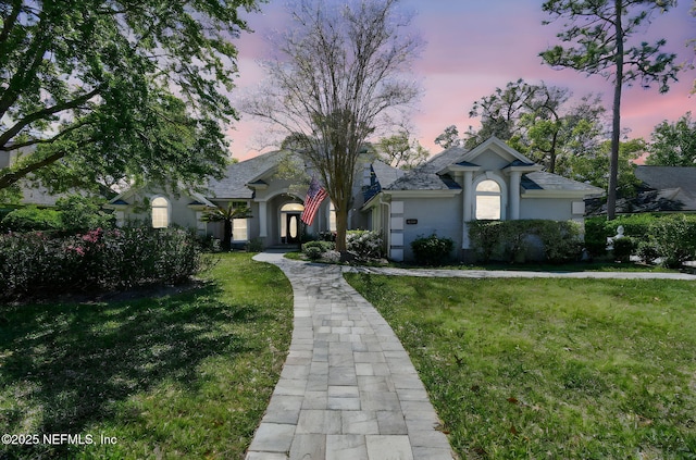 13022 Huntley Manor Dr, Jacksonville, FL 32224 - view of front of property featuring stucco siding and a front lawn