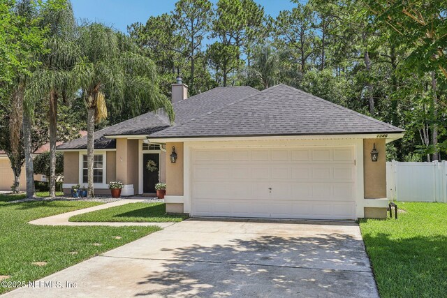 1346 N Kyle Way, Jacksonville, FL 32259 - ranch-style house with stucco siding, concrete driveway, a shingled roof, and a garage