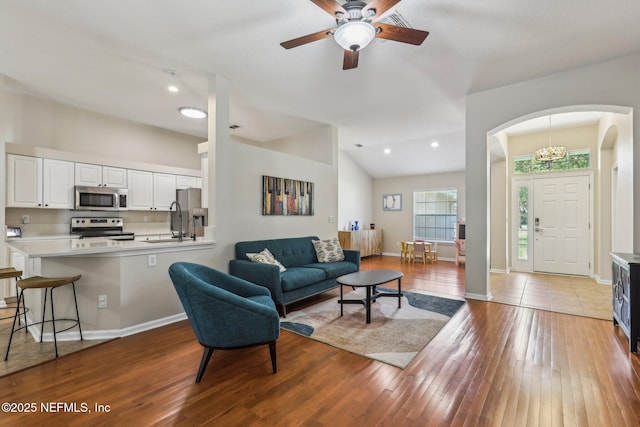 1346 N Kyle Way, Jacksonville, FL 32259 - living area featuring light wood-type flooring, arched walkways, ceiling fan, baseboards, and recessed lighting