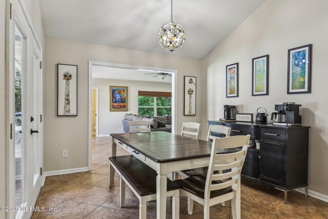 1346 N Kyle Way, Jacksonville, FL 32259 - dining room featuring a chandelier, dark tile patterned flooring, ceiling fan, baseboards, and vaulted ceiling
