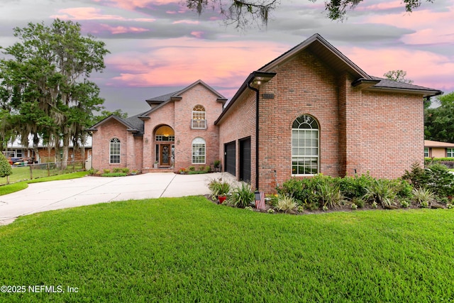 6449 Jack Wright Island Rd, Saint Augustine, FL 32092 - traditional-style home featuring brick siding, concrete driveway, and an attached garage