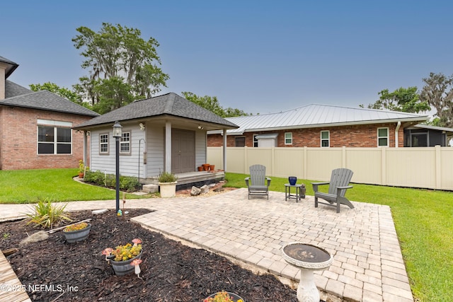 6449 Jack Wright Island Rd, Saint Augustine, FL 32092 - view of patio featuring an outdoor structure and a fire pit