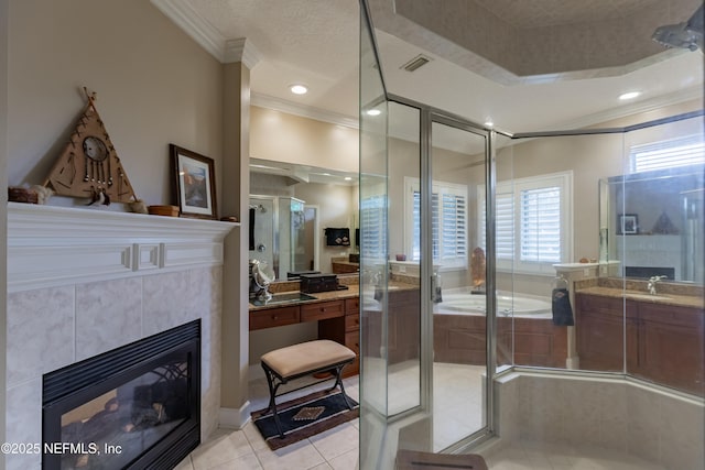 6449 Jack Wright Island Rd, Saint Augustine, FL 32092 - bathroom with ornamental molding, plenty of natural light, vanity, a tiled fireplace, and recessed lighting