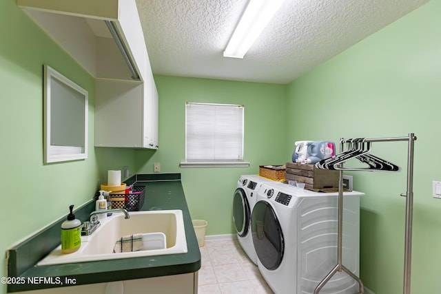 6449 Jack Wright Island Rd, Saint Augustine, FL 32092 - laundry area with independent washer and dryer, a textured ceiling, cabinet space, and light tile patterned flooring