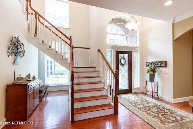 6449 Jack Wright Island Rd, Saint Augustine, FL 32092 - entryway featuring stairs, wood finished floors, baseboards, recessed lighting, and a towering ceiling