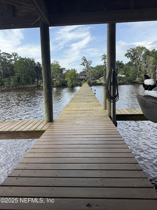6449 Jack Wright Island Rd, Saint Augustine, FL 32092 - dock area featuring a water view and view of wooded area