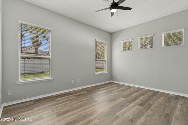 3353 Horseshoe Trail Dr, Orange Park, FL 32065 - spare room featuring ceiling fan, wood finished floors, and baseboards