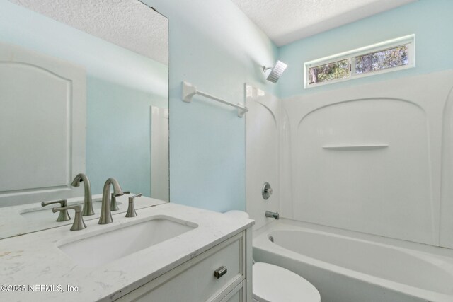 3353 Horseshoe Trail Dr, Orange Park, FL 32065 - bathroom featuring a textured ceiling, vanity, toilet, and  shower combination