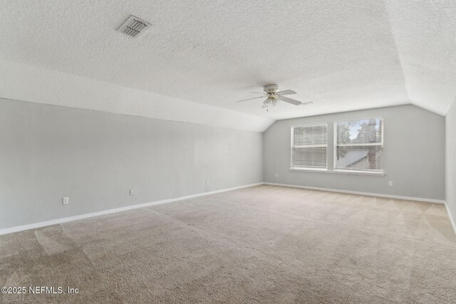 3353 Horseshoe Trail Dr, Orange Park, FL 32065 - bonus room featuring vaulted ceiling, a ceiling fan, carpet flooring, baseboards, and a textured ceiling