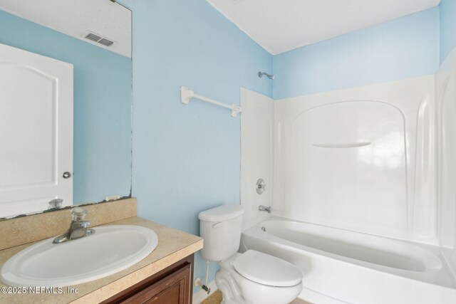 3353 Horseshoe Trail Dr, Orange Park, FL 32065 - bathroom featuring vanity, bathtub / shower combination, and toilet