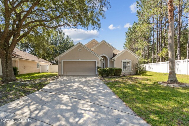 3353 Horseshoe Trail Dr, Orange Park, FL 32065 - view of front of property featuring concrete driveway, stucco siding, and a garage