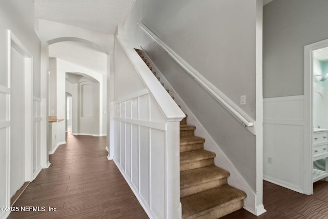 3353 Horseshoe Trail Dr, Orange Park, FL 32065 - stairway with arched walkways and wood finished floors