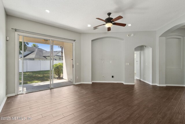 3353 Horseshoe Trail Dr, Orange Park, FL 32065 - empty room featuring arched walkways, a ceiling fan, wood finished floors, recessed lighting, and baseboards