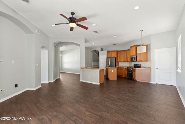 3353 Horseshoe Trail Dr, Orange Park, FL 32065 - unfurnished living room featuring arched walkways, ceiling fan, recessed lighting, baseboards, and dark wood-type flooring
