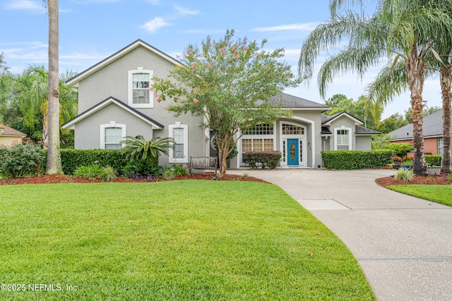 1758 Country Walk Dr, Fleming Island, FL 32003 - view of front facade with stucco siding, driveway, and a front yard