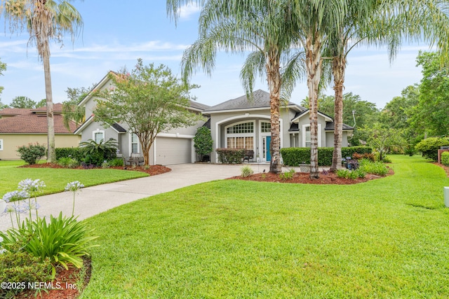 1758 Country Walk Dr, Fleming Island, FL 32003 - view of front of home featuring stucco siding, driveway, a garage, and a front yard