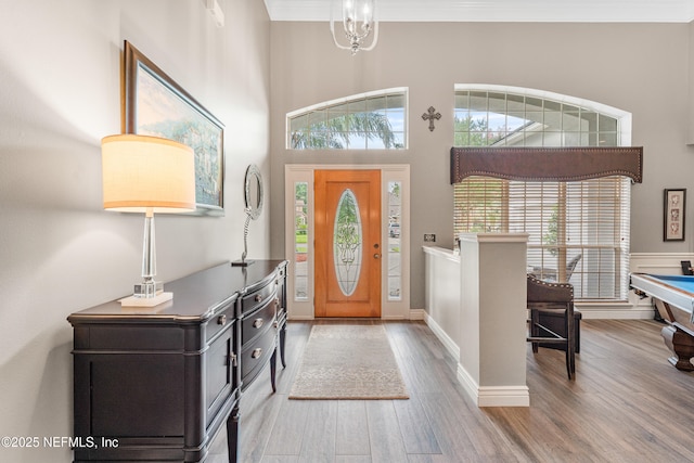 1758 Country Walk Dr, Fleming Island, FL 32003 - foyer entrance featuring wood finished floors, plenty of natural light, ornamental molding, and billiards