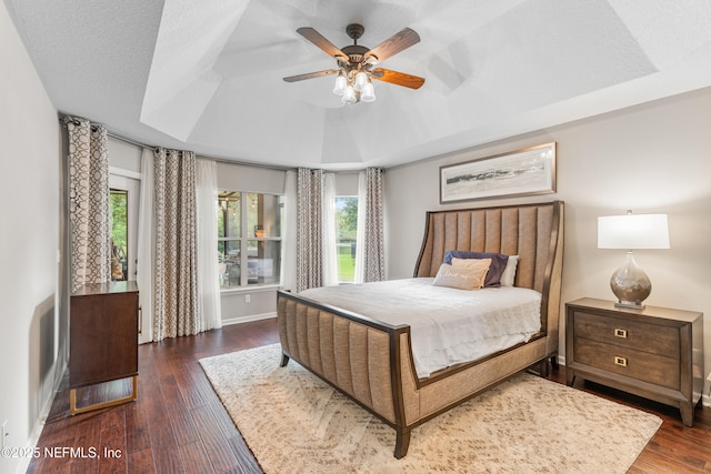 1758 Country Walk Dr, Fleming Island, FL 32003 - bedroom featuring a raised ceiling, multiple windows, wood finished floors, and ceiling fan