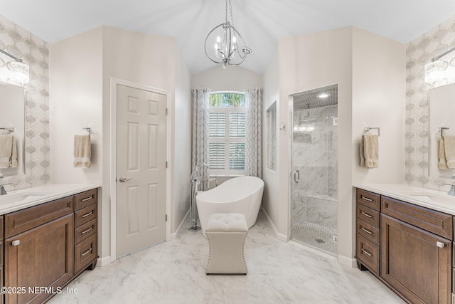 1758 Country Walk Dr, Fleming Island, FL 32003 - full bathroom with a marble finish shower, two vanities, a chandelier, a freestanding bath, and vaulted ceiling