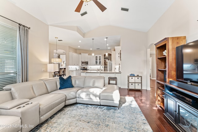 1758 Country Walk Dr, Fleming Island, FL 32003 - living room with a ceiling fan, arched walkways, lofted ceiling, and dark wood-type flooring