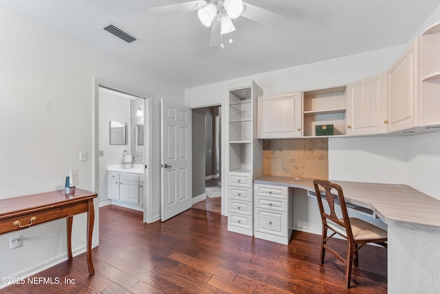 1758 Country Walk Dr, Fleming Island, FL 32003 - office with ceiling fan, dark wood-type flooring, built in desk, and a textured ceiling