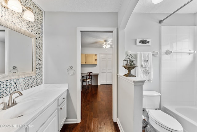 1758 Country Walk Dr, Fleming Island, FL 32003 - full bath with vanity, a textured ceiling, a ceiling fan, hardwood / wood-style floors, and washtub / shower combination