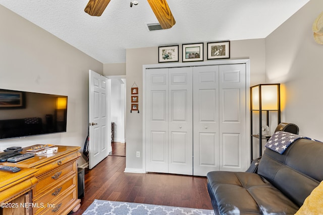 1758 Country Walk Dr, Fleming Island, FL 32003 - living room with ceiling fan, dark wood-type flooring, and a textured ceiling
