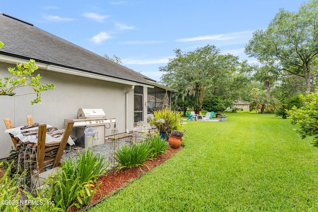 1758 Country Walk Dr, Fleming Island, FL 32003 - view of grassy yard featuring an outdoor fire pit, a sunroom, and a patio area