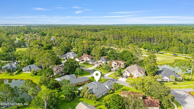 1758 Country Walk Dr, Fleming Island, FL 32003 - aerial view of residential area featuring a heavily wooded area and a large body of water