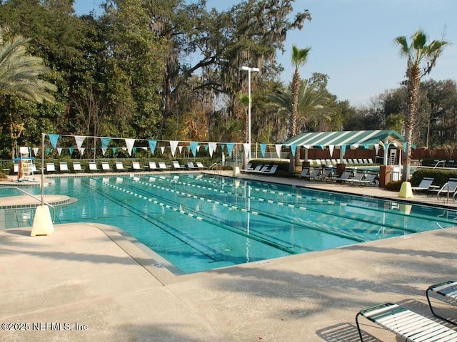 1758 Country Walk Dr, Fleming Island, FL 32003 - community pool with a patio area and view of wooded area