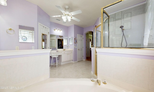 1700 Waters Edge Dr, Fleming Island, FL 32003 - bathroom with ceiling fan, a bath, walk in shower, and vanity