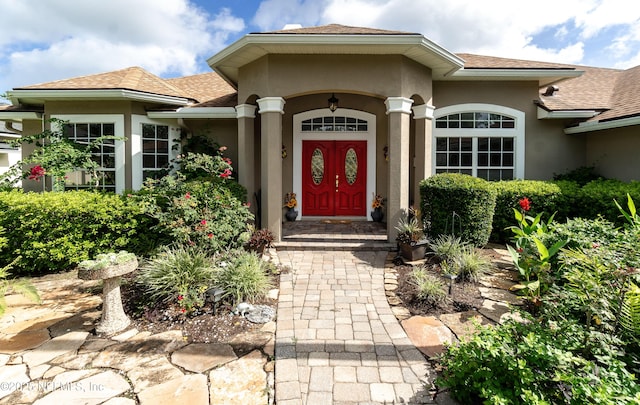 1700 Waters Edge Dr, Fleming Island, FL 32003 - property entrance with roof with shingles and stucco siding