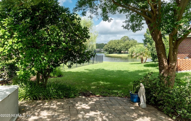 1700 Waters Edge Dr, Fleming Island, FL 32003 - view of grassy yard featuring a water view and a patio area