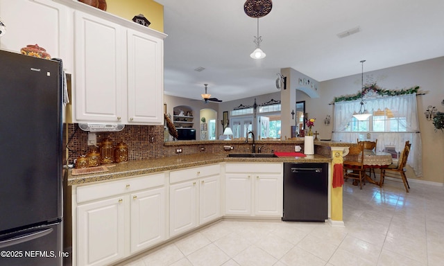 1700 Waters Edge Dr, Fleming Island, FL 32003 - kitchen with a sink, black appliances, a ceiling fan, backsplash, and light tile patterned floors