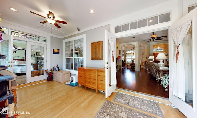 1700 Waters Edge Dr, Fleming Island, FL 32003 - foyer entrance with a ceiling fan, light wood-style flooring, recessed lighting, ornate columns, and arched walkways