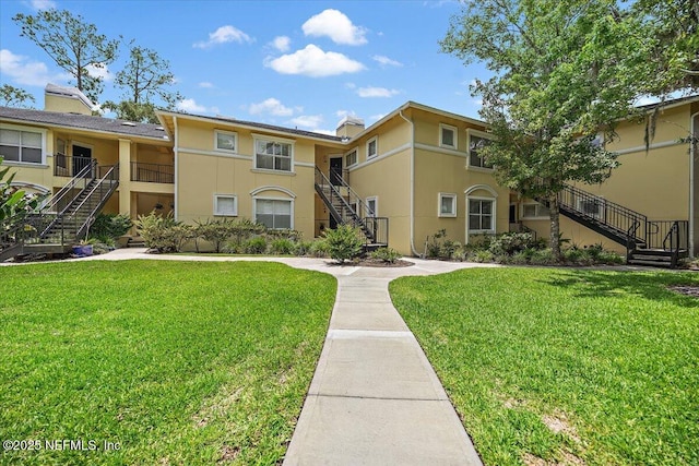 1800 The Greens Way Unit 1907, Jacksonville Beach, FL 32250 - view of building exterior featuring stairs