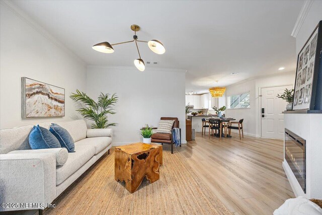 1800 The Greens Way Unit 1907, Jacksonville Beach, FL 32250 - living room featuring crown molding, light wood-style floors, baseboards, and recessed lighting