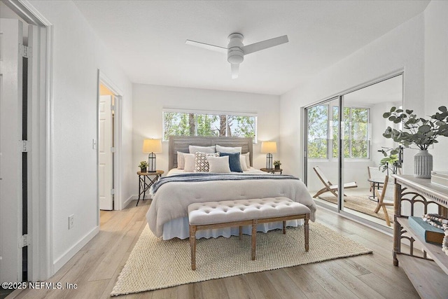 1800 The Greens Way Unit 1907, Jacksonville Beach, FL 32250 - bedroom featuring light wood-type flooring, a ceiling fan, baseboards, and access to exterior